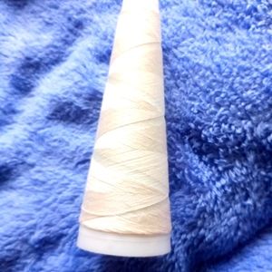 White thread spool
